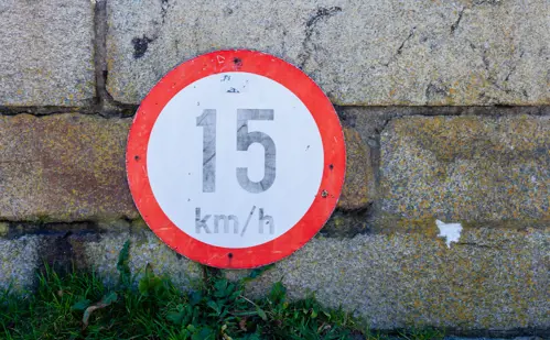 Irish speed limit sign on stone wall