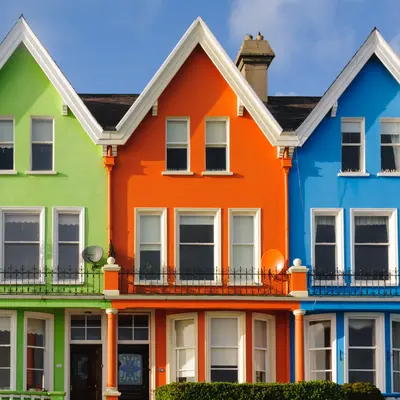 Row Of Brightly Painted Multicoloured Houses In Whitehead, Northern Ireland